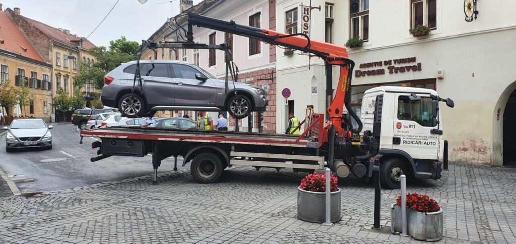 ridicat mașini staționate ilegal